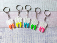 neon tooth keyrings