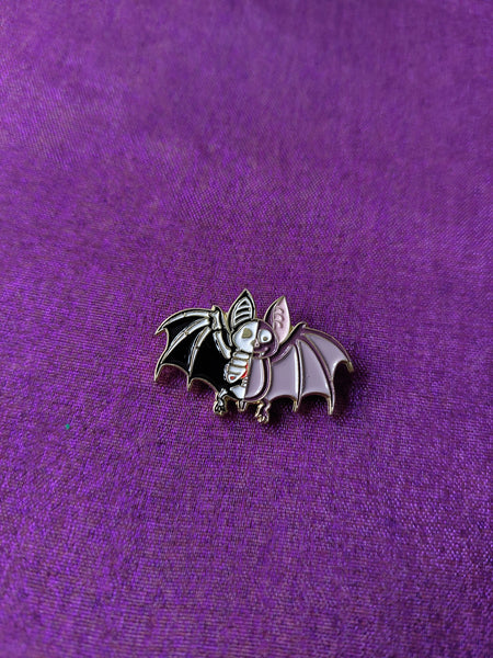 half-skeleton bat pin badge