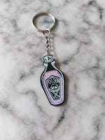 pink poison bottle keyring 