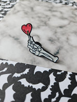 lollipop skeleton hand pin badge