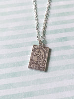 tarot card necklace - the world 