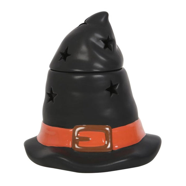 A black ceramic oil burner and wax warmer shaped like a witch hat with a stars pattern and an orange band at the base.