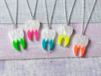 neon tooth necklaces