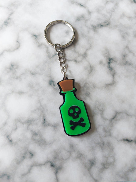 green skull poison bottle keyring 