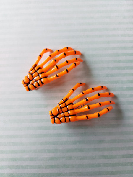skeleton hand hair clips - orange