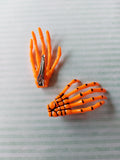 skeleton hand hair clips - orange
